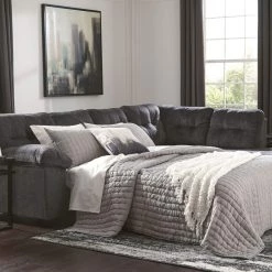 Signature Design By Ashley® Accrington - Sleeper Sectional With Chaise Sectionals
