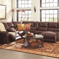 Ashley Furniture Rogness - Rustic Brown - Round Cocktail Table Tables