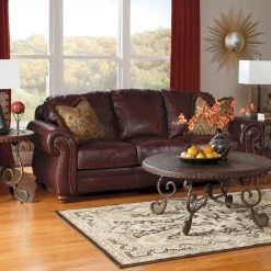Ashley Furniture Rafferty - Dark Brown - Round End Table