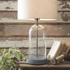 Ashley Furniture Accessories Manelin - Clear/gray - Glass Table Lamp (1/cn)