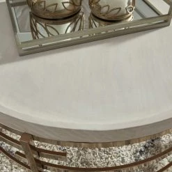 Signature Design By Ashley® Montiflyn - White/gold Finish - Round Cocktail Table Tables