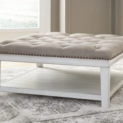 Signature Design By Ashley® Ottomans Kanwyn - Whitewash - Uph Ottoman Cocktail Table