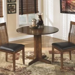 Ashley Furniture Tables Stuman - Light Brown - Round Drm Drop Leaf Table
