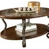 Ashley Furniture Tables Nestor - Medium Brown - Oval Cocktail Table