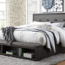 Signature Design By Ashley® Hyndell - Dark Brown - California King Upholstered Panel Bed With Storage