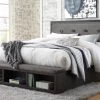 Signature Design By Ashley® Hyndell - Dark Brown - Queen Upholstered Panel Bed With Storage