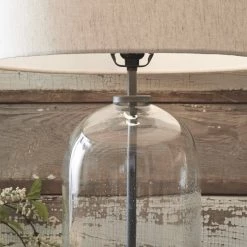 Ashley Furniture Accessories Manelin - Clear/gray - Glass Table Lamp (1/cn)