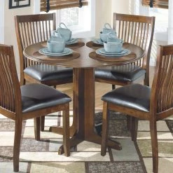 Ashley Furniture Tables Stuman - Light Brown - Round Drm Drop Leaf Table
