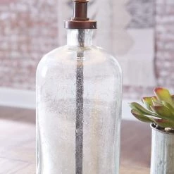 Ashley Furniture Bandile - Clear/bronze Finish - Glass Table Lamp (1/cn)