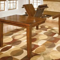 Ashley Furniture Ralene - Medium Brown - Rect Drm Butterfly Ext Table